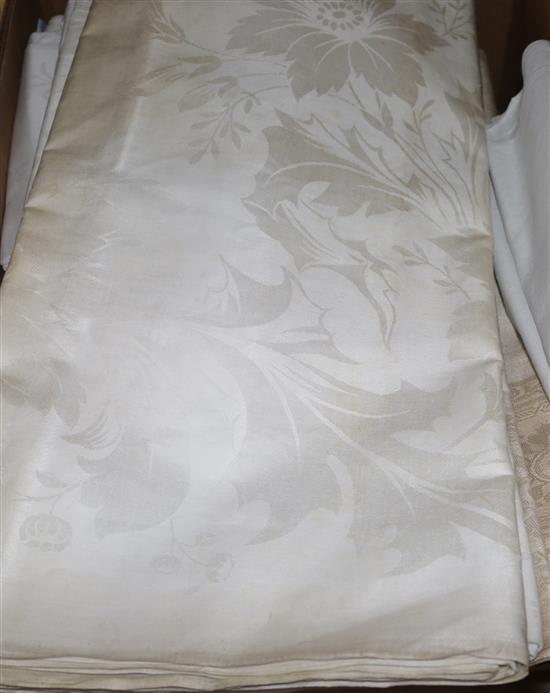 A collection of Damask table cloths, napkins, sheets, etc.